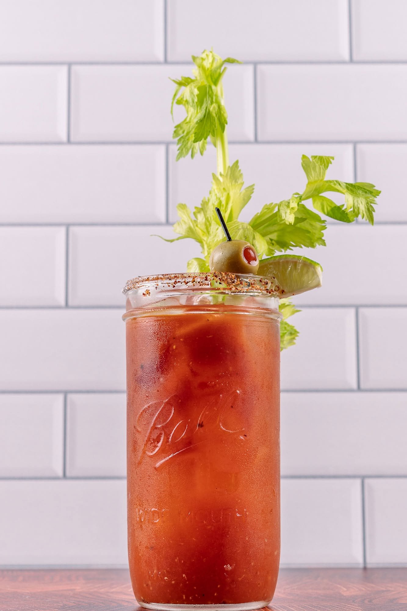 House bloody mary with celery, olive and lime