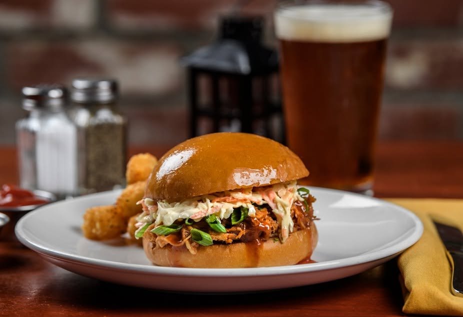 BBQ pulled pork sandwich with a craft beer at Melville Tavern
